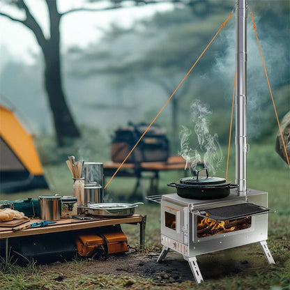Camping stove with pots and pans on a table outdoors, with a tent and trees in the background.