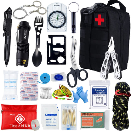 Collection of emergency survival tools and first aid items including a black backpack with a red cross, scissors, pliers, and bandages.