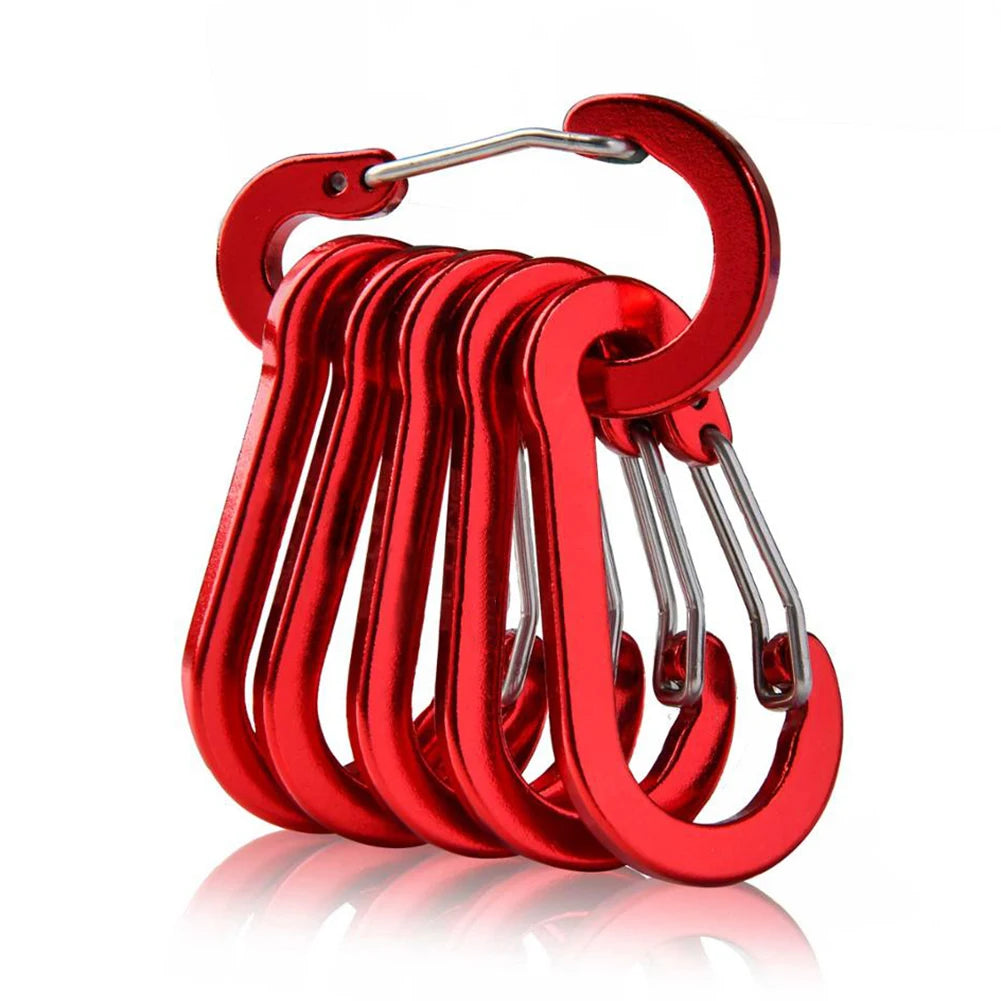 Set of red carabiners on a white background